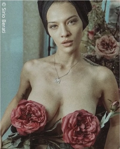 Photograph of a woman with flowers over her chest